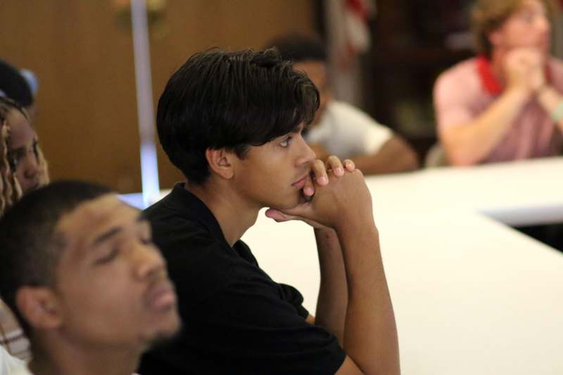 a man with his hand on his chin
