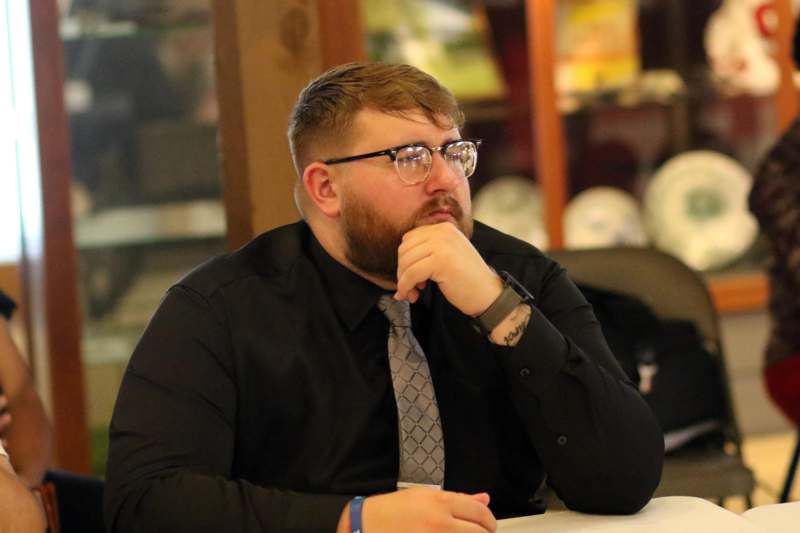 a man in glasses and a tie