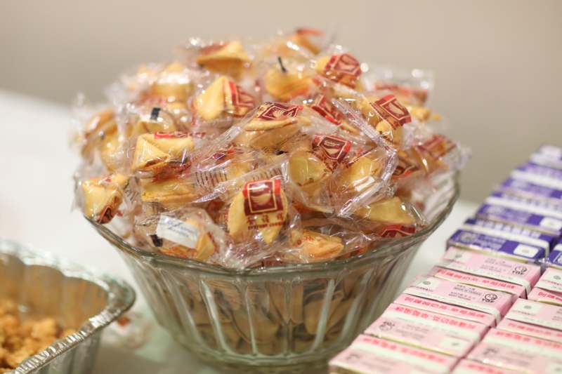 a bowl of food in plastic wrappers