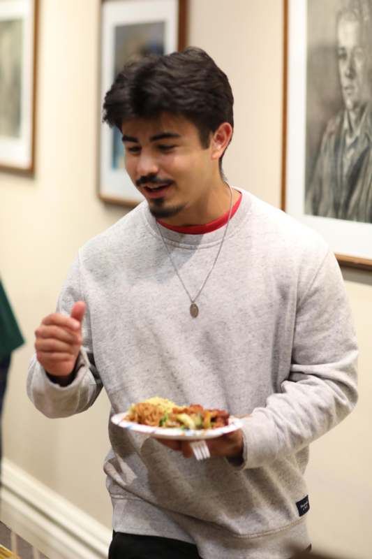 a man holding a plate of food