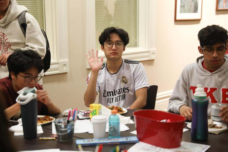 a group of people sitting at a table
