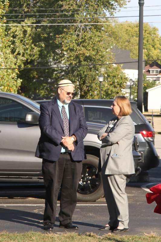 a man and woman standing outside