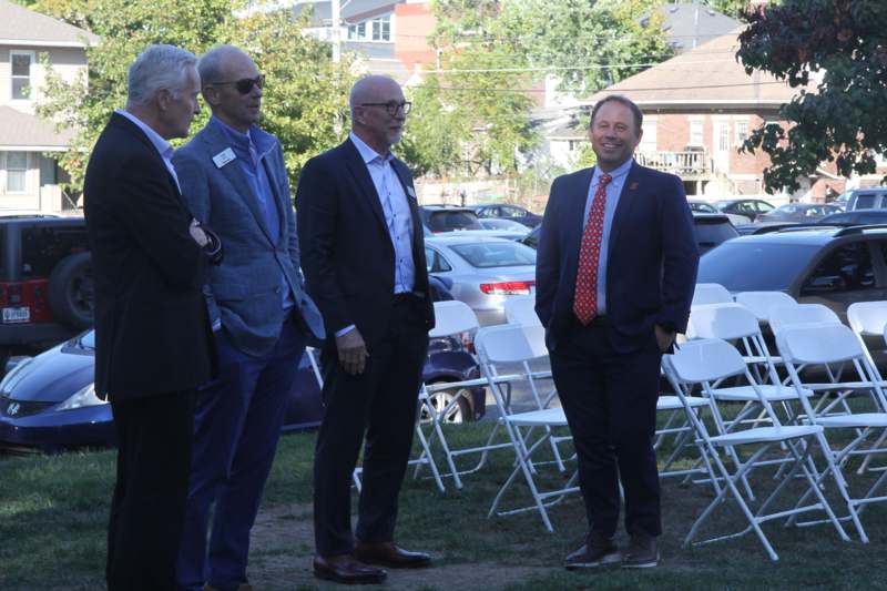 a group of men standing in a row