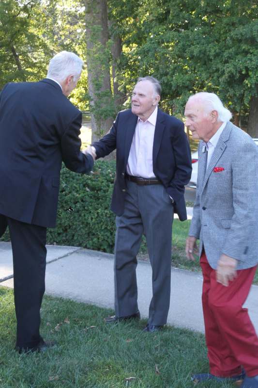 a group of men shaking hands