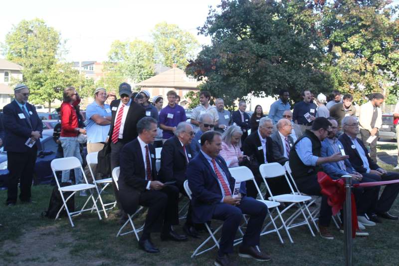a group of people sitting in chairs