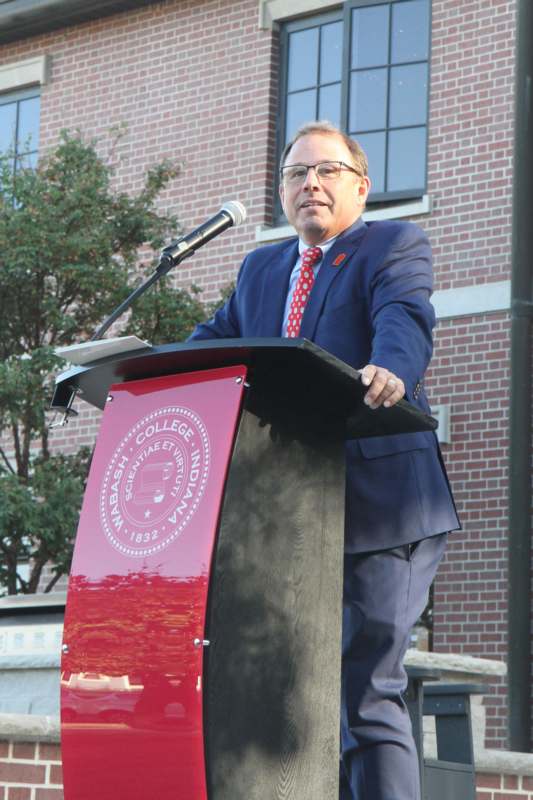 a man standing at a podium