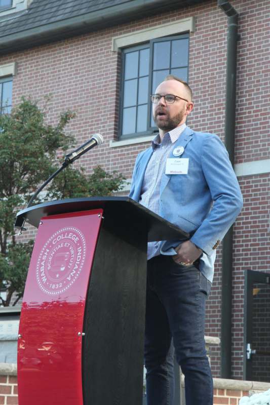 a man standing at a podium
