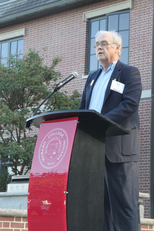 a man standing at a podium
