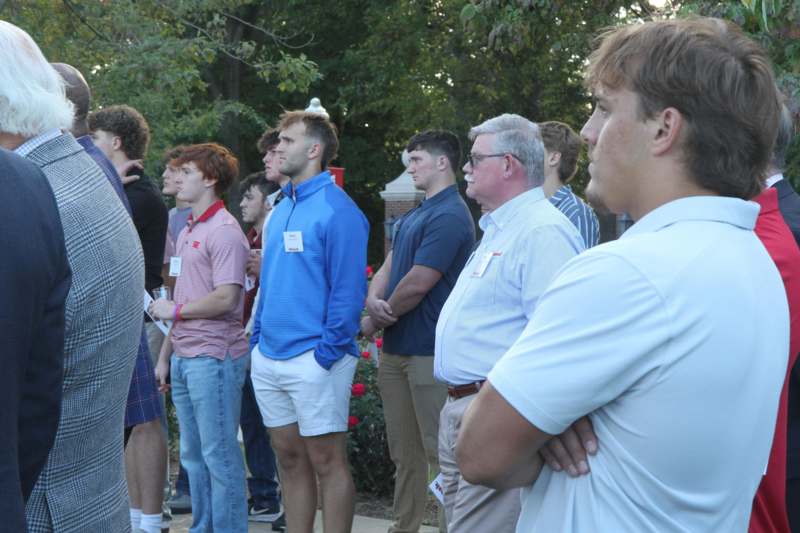a group of people standing in a line