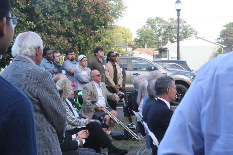 a group of people sitting in a row