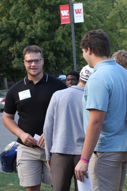 a group of men standing outside
