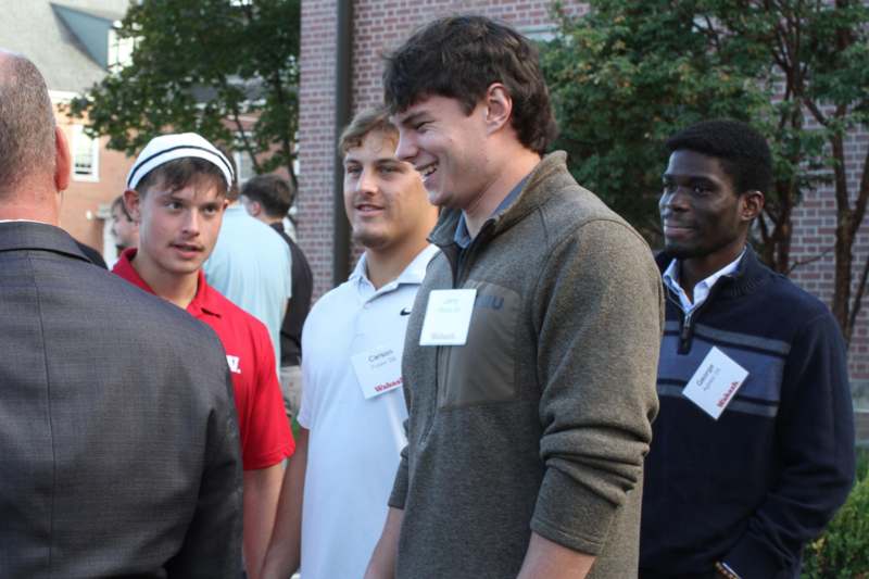 a group of men standing outside