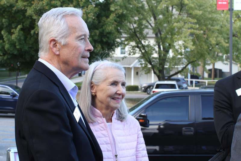 a man and woman standing outside