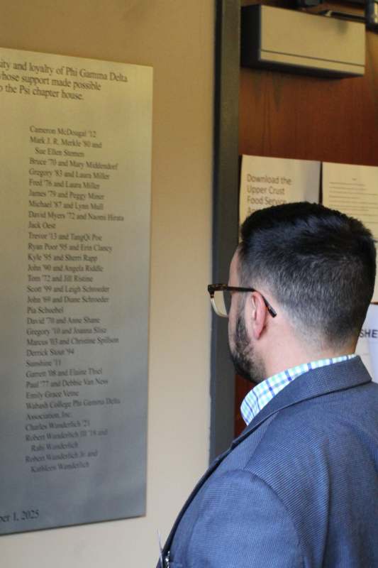 a man looking at a sign