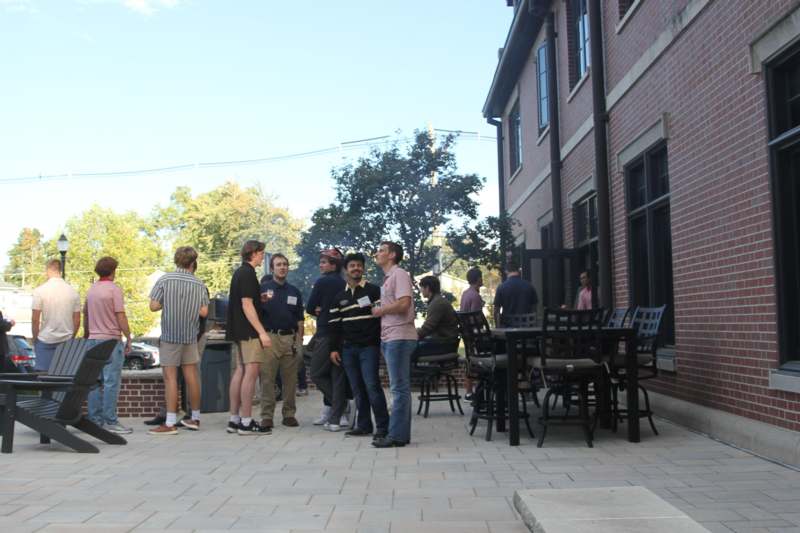 a group of people standing outside a building