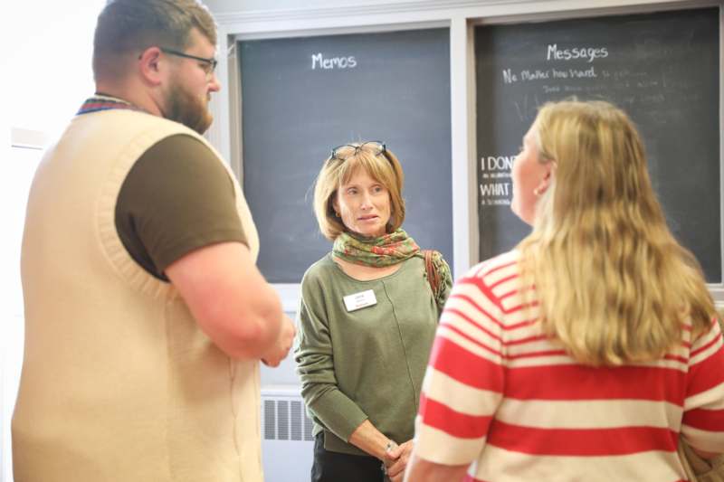 a group of people standing in a room