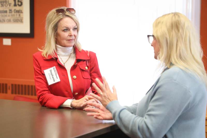 a woman talking to another woman