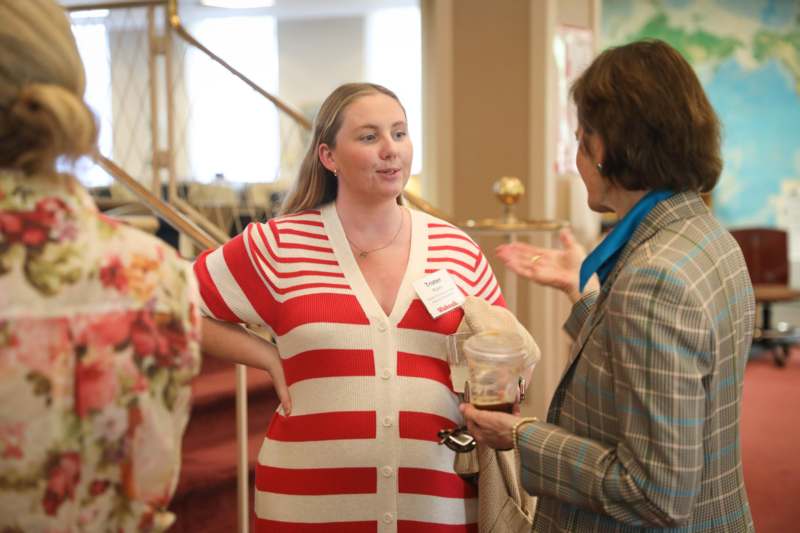 a woman talking to another woman