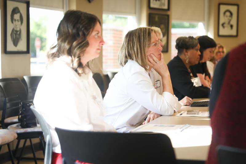 a group of women sitting at a table