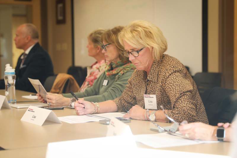 a group of women sitting at a table
