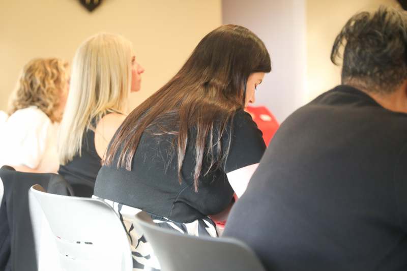 a group of women sitting in chairs