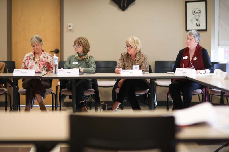 a group of women sitting at a table