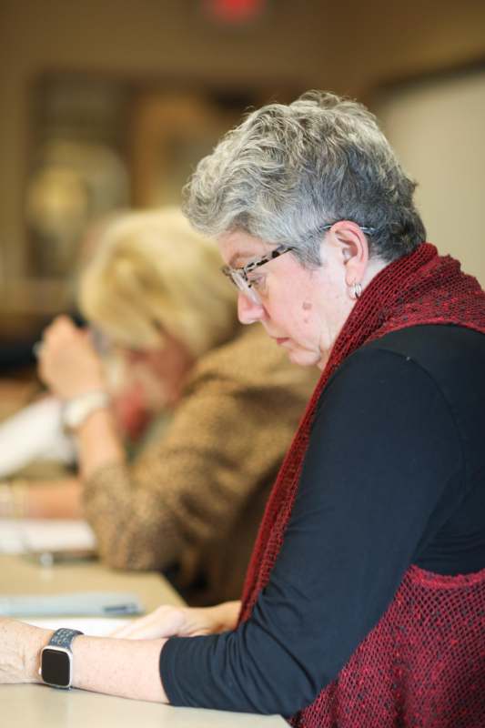 a woman sitting at a table