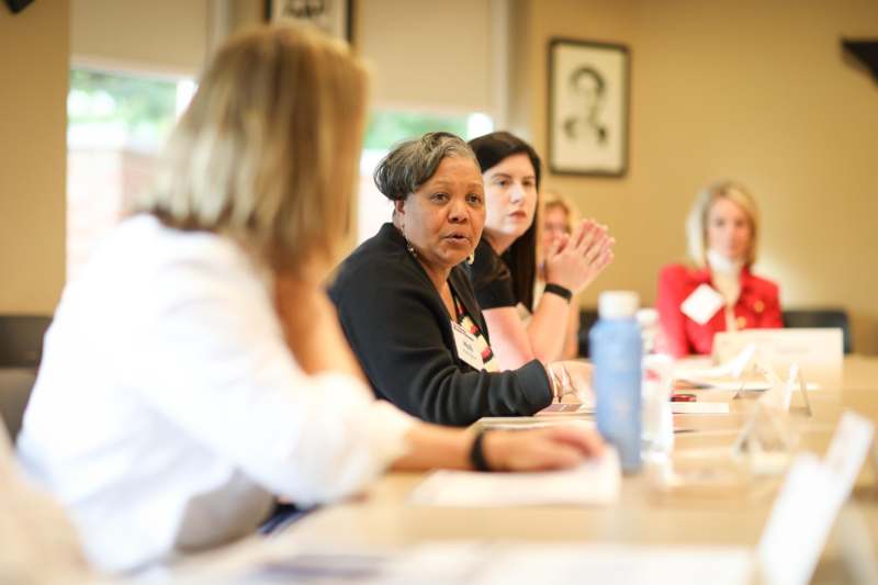 a group of women sitting at a table