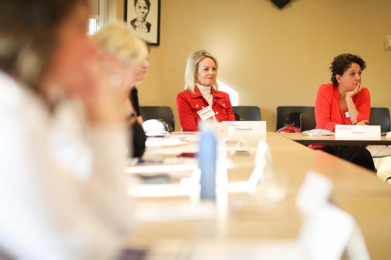 a group of women sitting at a table
