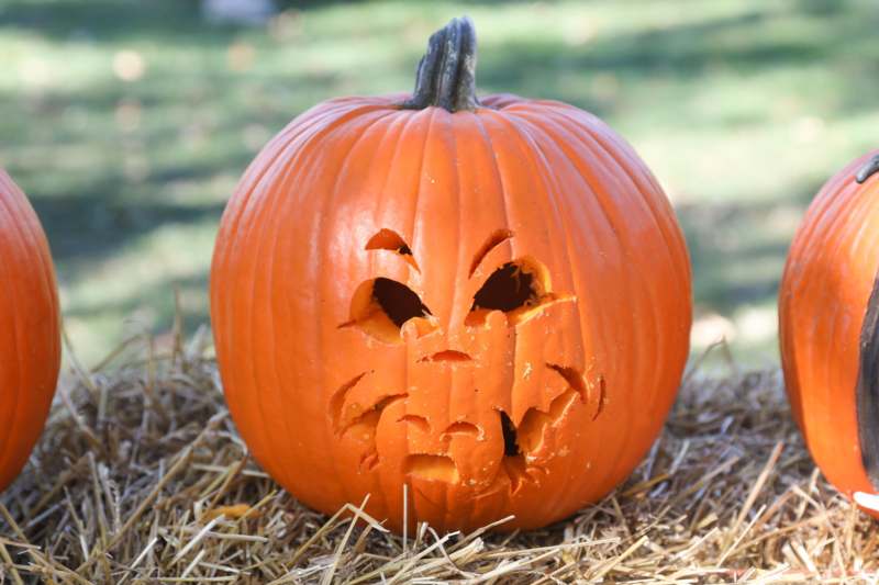 a pumpkin with a face carved into it