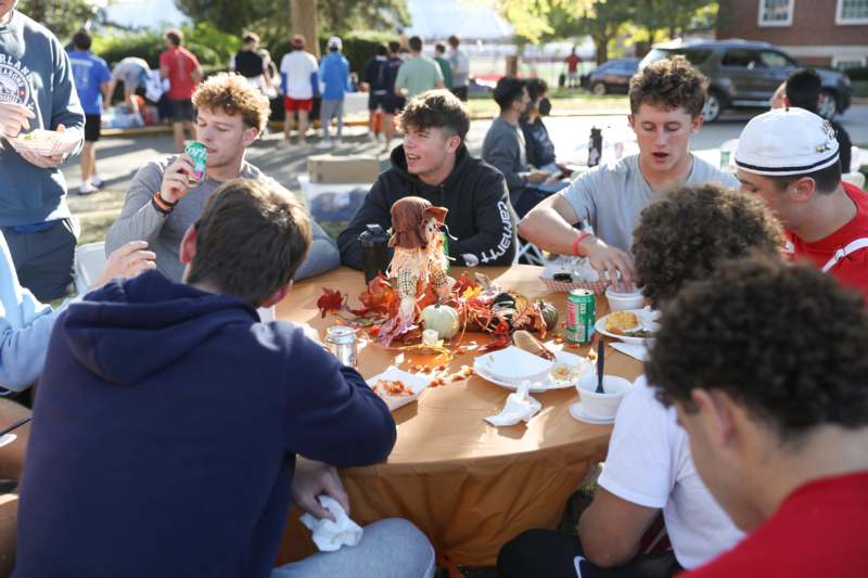 a group of people sitting around a table