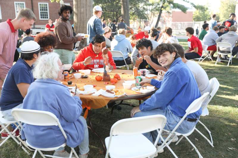 a group of people sitting around a table