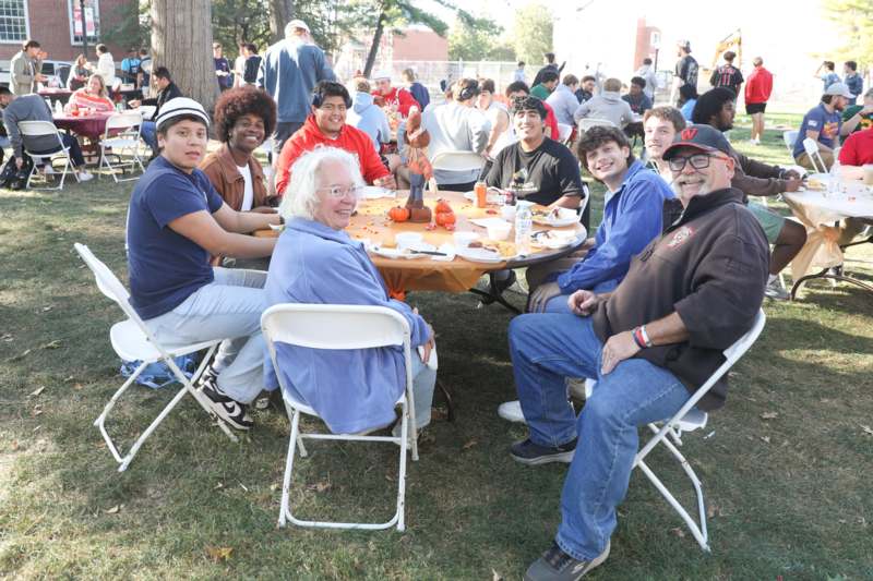 a group of people sitting around a table
