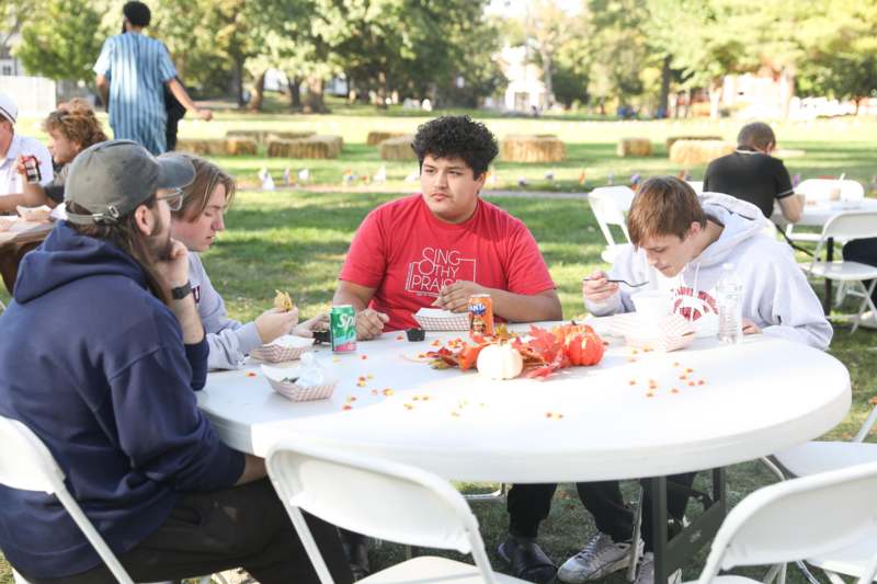 a group of people sitting at a table