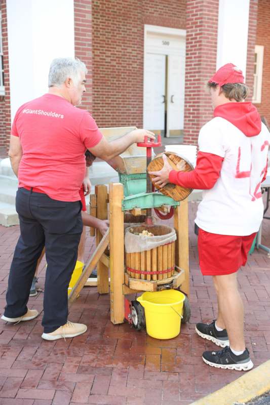 a group of men working on a machine