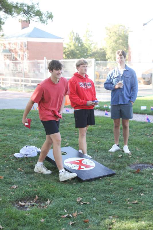 a group of men standing on grass