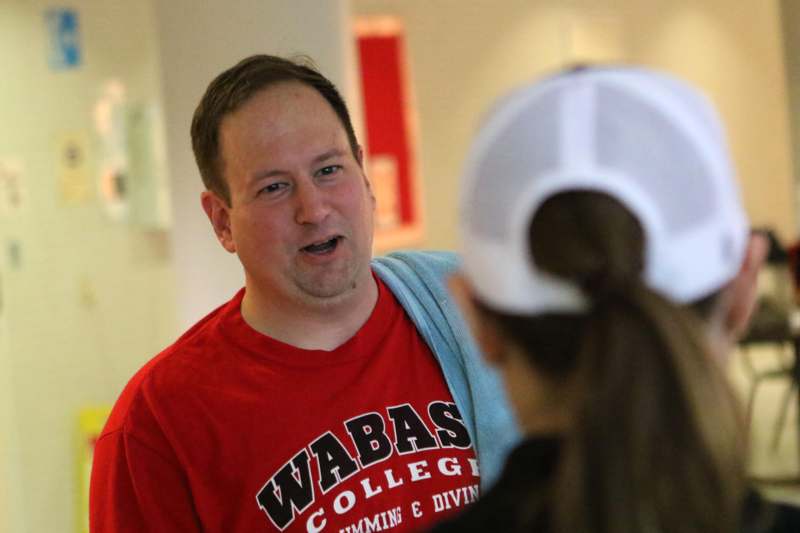 a man talking to a woman