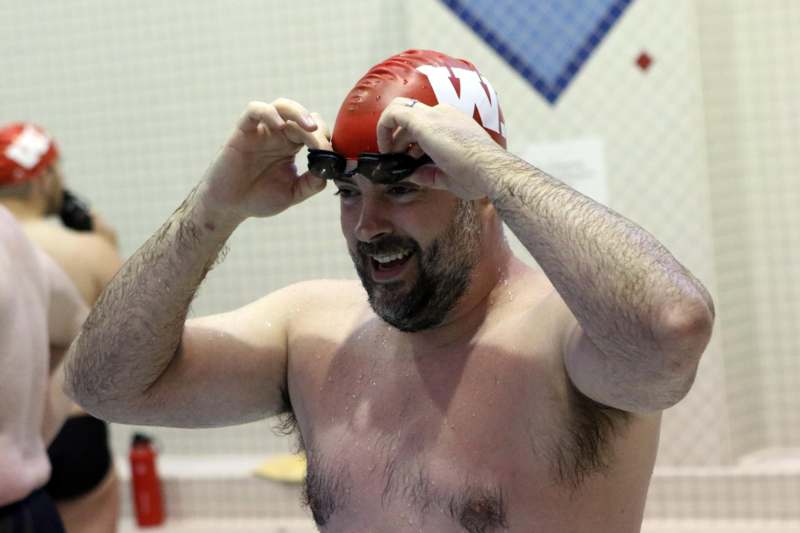 a man wearing a swim cap