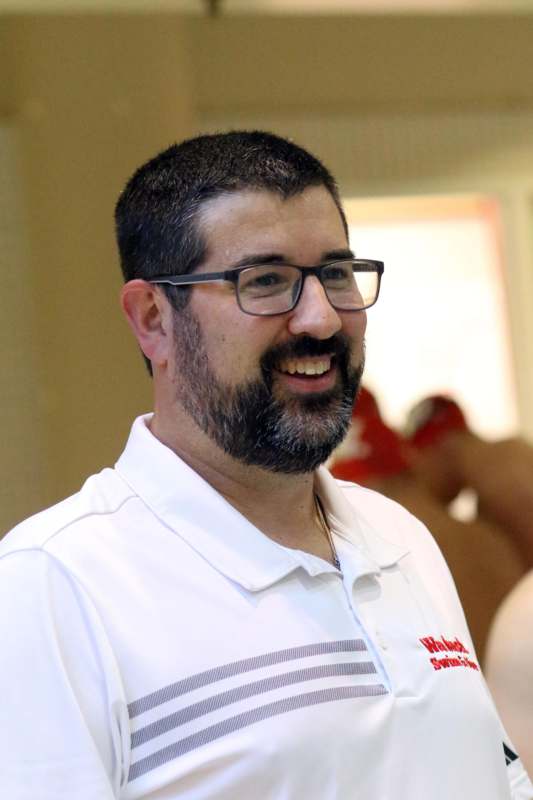 a man with a beard and glasses