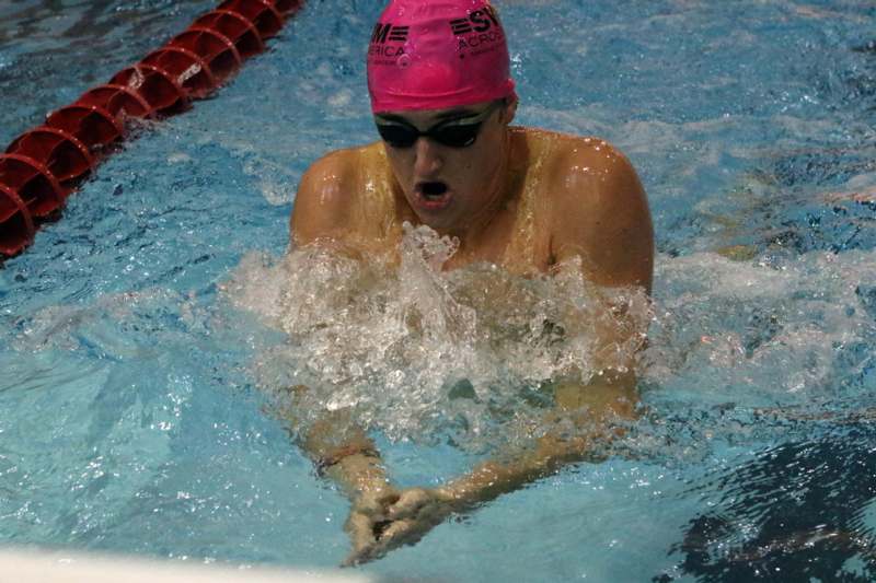 a person swimming in a pool