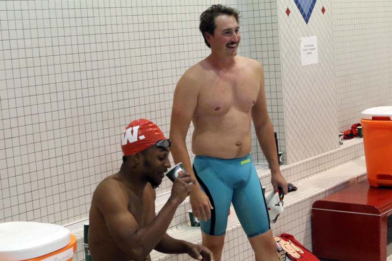 a group of men in swim trunks