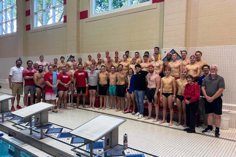 Swimming Alumni Meet - a group of people standing in a swimming pool