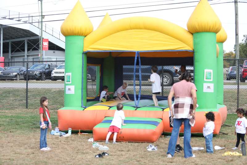 a group of kids playing in a bounce house