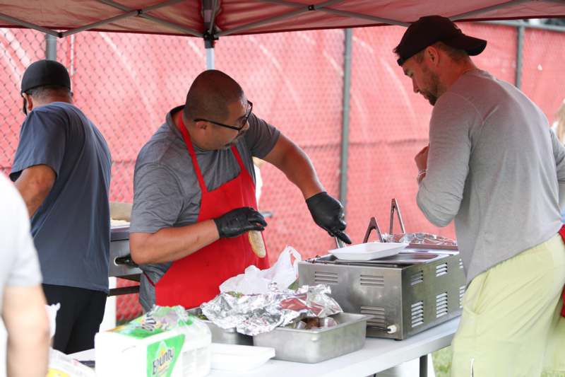 a group of men cooking food