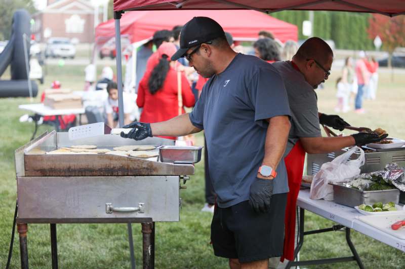 a man cooking food outside