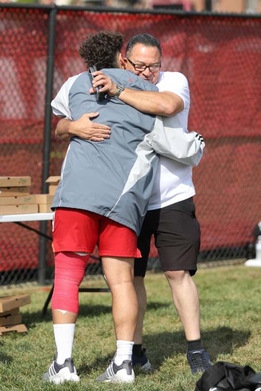 two men hugging each other