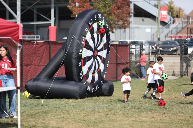 a group of kids playing in a field