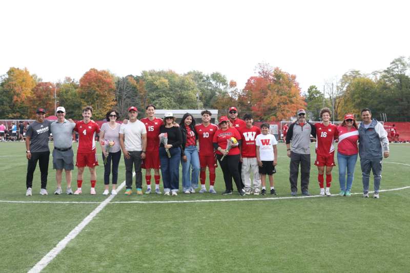 a group of people standing on a field