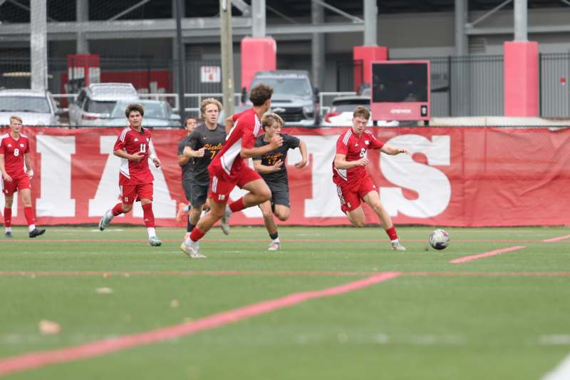 a group of men playing football