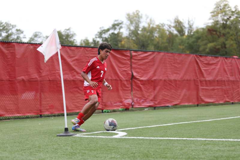 a man running with a football ball